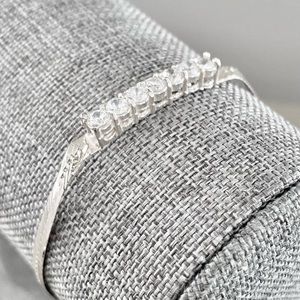 Lovely .925 sterling herringbone bracelet with (7) brilliant faceted 2mm CZs